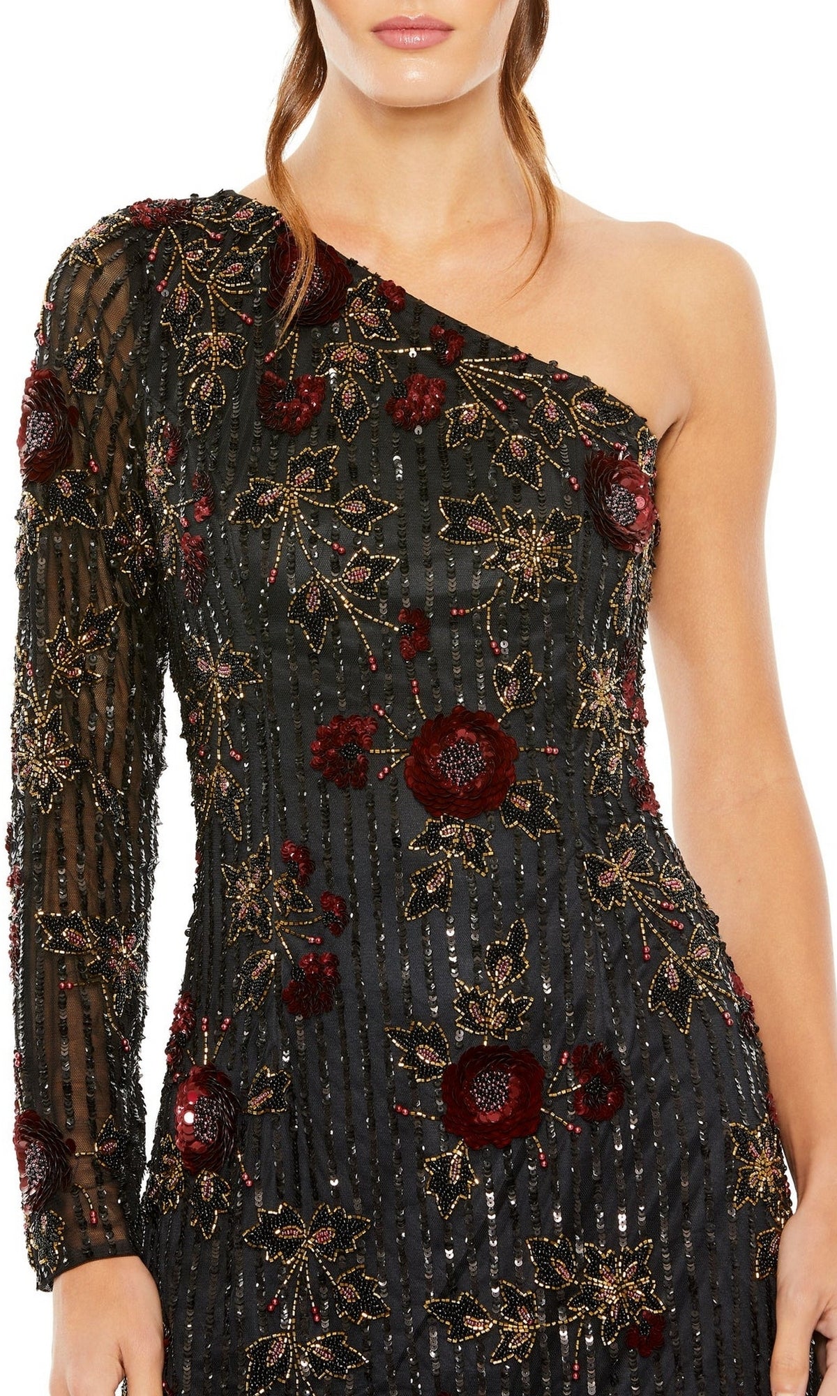 A woman wears the Short Homecoming Dress 5919 by Mac Duggal, a floral dress with an asymmetrical black design, one long sleeve, and striking red and gold embroidery.